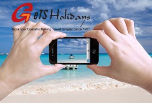 Close up photo of a female tourist taking photos of a beautiful beach in The Bahamas with her iPhone 4 camera